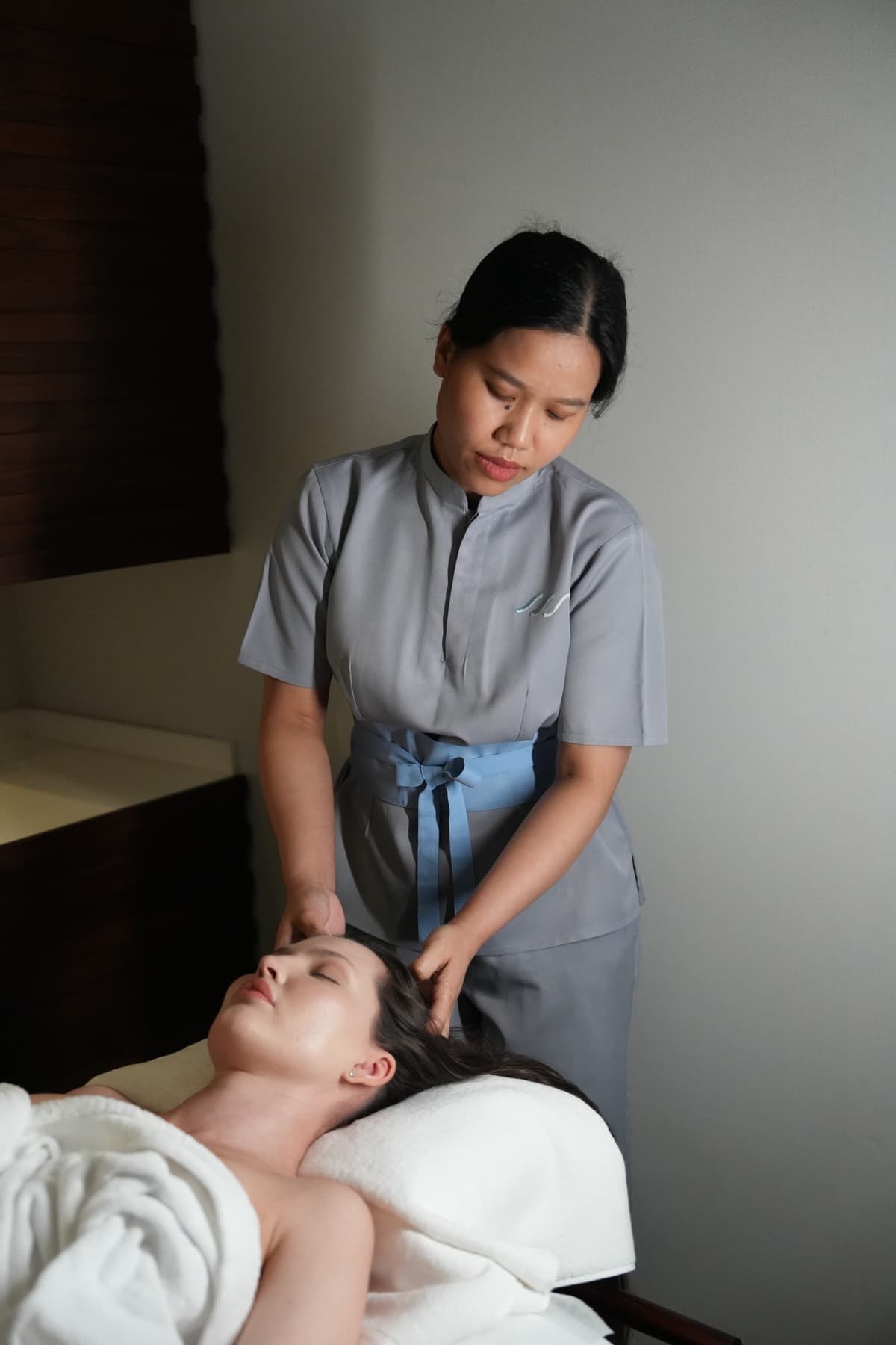 A Sea Salt Spa therapist working on a guest's head and neck